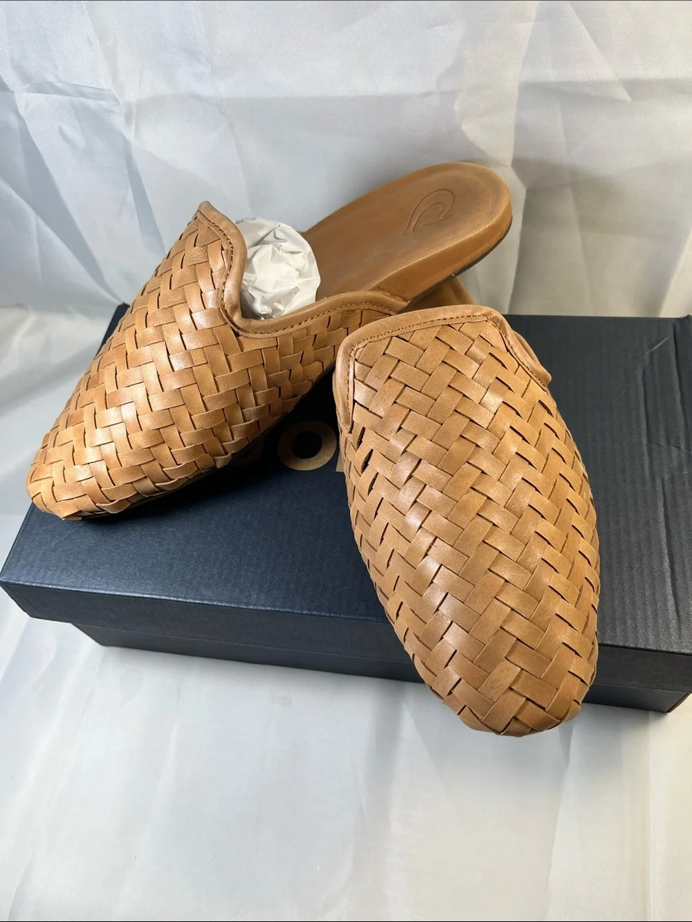 OluKai women’s Tan Woven Leather Slip-On Loafers